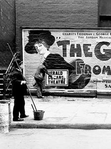 A billposter with his long brush and bucket, 1904.